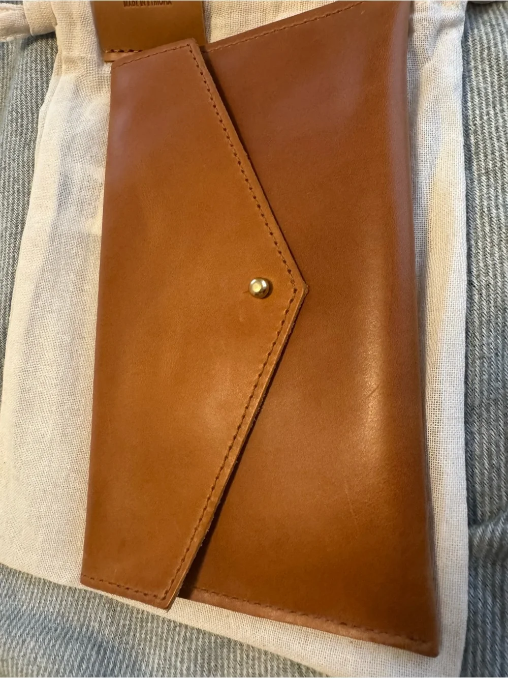 Parker Clay tan leather envelope clutch with drawstring bag